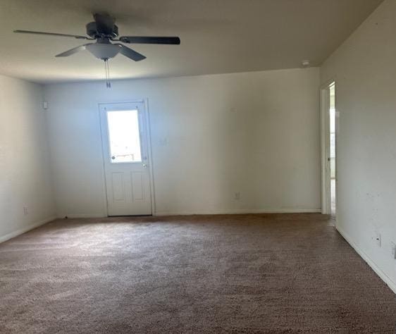 15215 Snug Harbor Way, Von Ormy, TX 78073 - unfurnished room with carpet, a ceiling fan, and baseboards