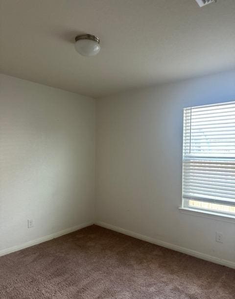 15215 Snug Harbor Way, Von Ormy, TX 78073 - unfurnished room with carpet, plenty of natural light, and baseboards