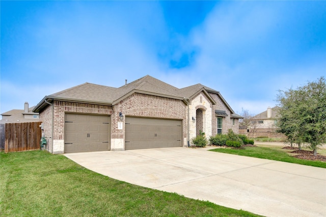 3502 Harper Ferry Pl, Katy, TX 77494 - french country style house featuring brick siding, an attached garage, driveway, and a shingled roof