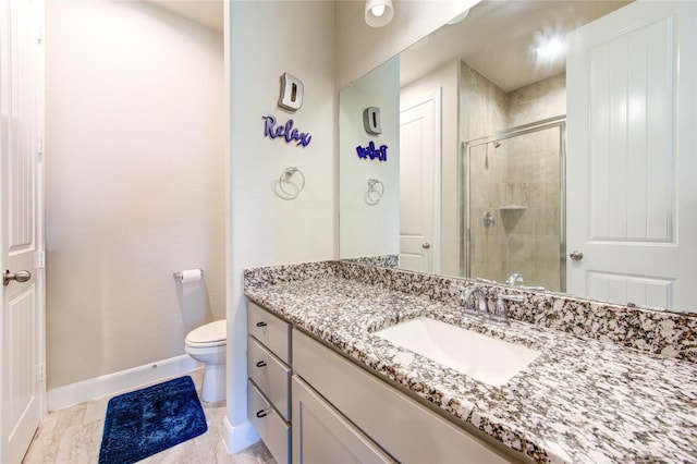 3502 Harper Ferry Pl, Katy, TX 77494 - full bathroom featuring baseboards, a shower stall, vanity, and toilet