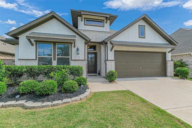 26415 Polaris Rise Ln, Richmond, TX 77406 - view of front of home with concrete driveway, a garage, stucco siding, brick siding, and a front yard