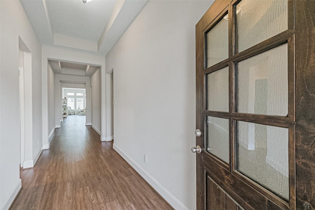 26415 Polaris Rise Ln, Richmond, TX 77406 - hall with dark wood-style flooring, baseboards, and a raised ceiling