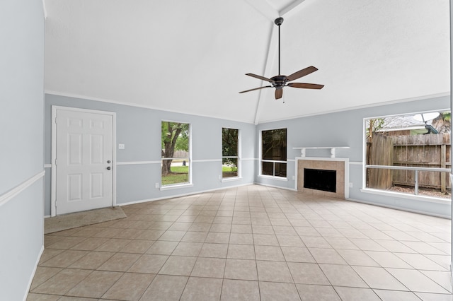 9702 Pale Star Dr, Houston, TX 77064 - unfurnished living room featuring a ceiling fan, light tile patterned floors, a tiled fireplace, high vaulted ceiling, and baseboards