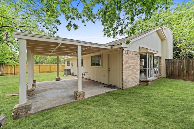 9702 Pale Star Dr, Houston, TX 77064 - back of house featuring a patio, a shingled roof, central AC unit, and brick siding