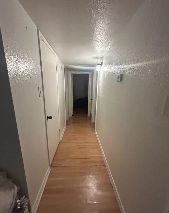 5625 Antoine Dr Unit 705, Houston, TX 77091 - hall featuring light wood-style flooring and baseboards