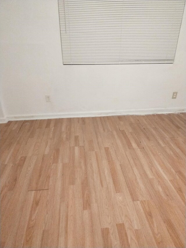 5625 Antoine Dr Unit 705, Houston, TX 77091 - empty room featuring wood finished floors and baseboards