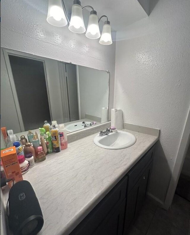 5625 Antoine Dr Unit 705, Houston, TX 77091 - bathroom with vanity and a textured wall