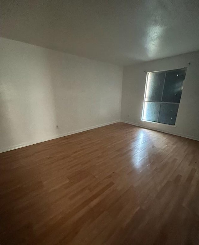 5625 Antoine Dr Unit 705, Houston, TX 77091 - spare room featuring wood finished floors and baseboards