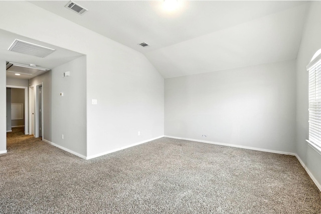 32719 Oak Heights Ln, Brookshire, TX 77423 - empty room with carpet flooring, attic access, vaulted ceiling, and baseboards