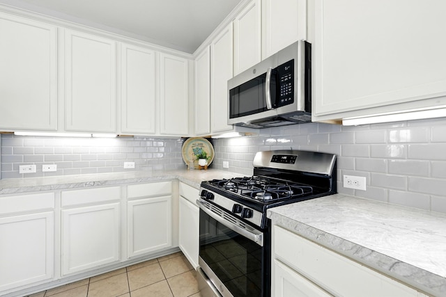 32719 Oak Heights Ln, Brookshire, TX 77423 - kitchen featuring appliances with stainless steel finishes, white cabinets, and light countertops