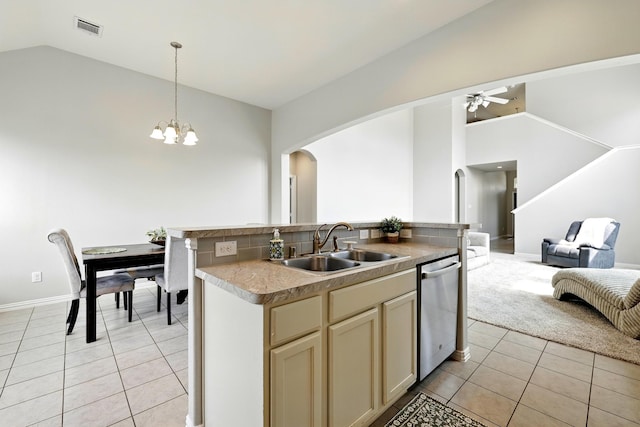 32719 Oak Heights Ln, Brookshire, TX 77423 - kitchen featuring vaulted ceiling, arched walkways, open floor plan, stainless steel dishwasher, and light tile patterned flooring