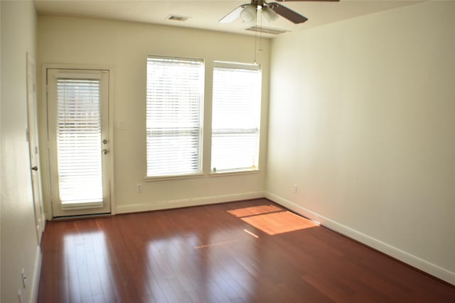 3123 Dallas St, Houston, TX 77003 - empty room with ceiling fan, healthy amount of natural light, wood finished floors, and baseboards