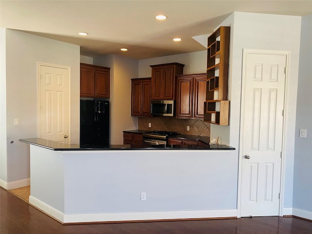 3123 Dallas St, Houston, TX 77003 - kitchen with stainless steel appliances, open shelves, dark countertops, backsplash, and recessed lighting