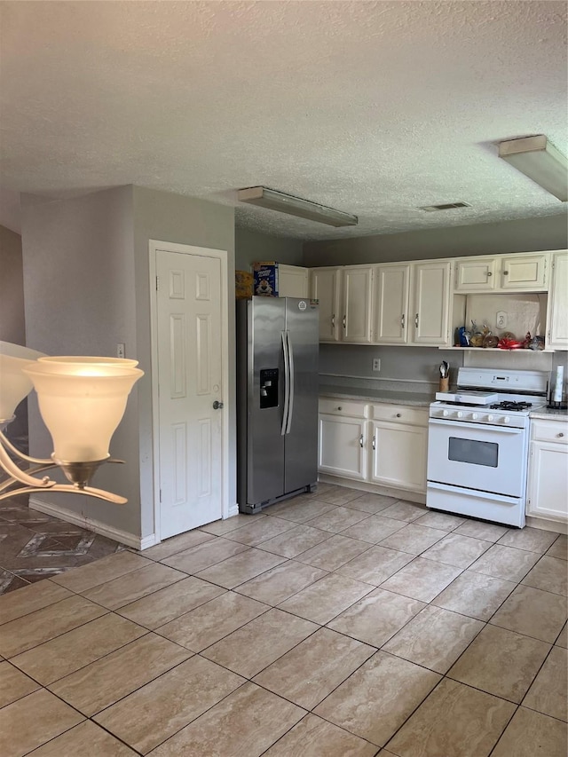 12147 Swords Creek Rd, Houston, TX 77067 - kitchen featuring stainless steel fridge with ice dispenser, white gas range oven, white cabinets, a textured ceiling, and light tile patterned floors