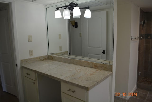7575 Katy Fwy Unit 9, Houston, TX 77024 - bathroom featuring vanity, a shower stall, and tile patterned flooring