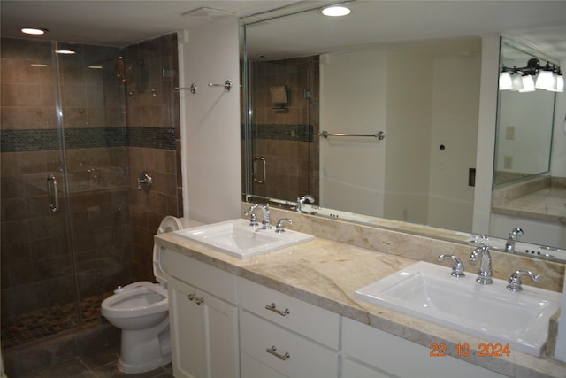 7575 Katy Fwy Unit 9, Houston, TX 77024 - full bathroom with a shower stall, toilet, double vanity, and recessed lighting