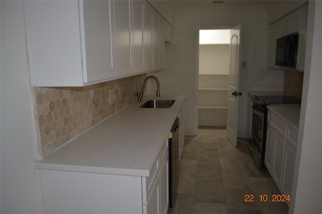 7575 Katy Fwy Unit 9, Houston, TX 77024 - kitchen featuring a sink, black microwave, stainless steel electric range, backsplash, and dishwasher