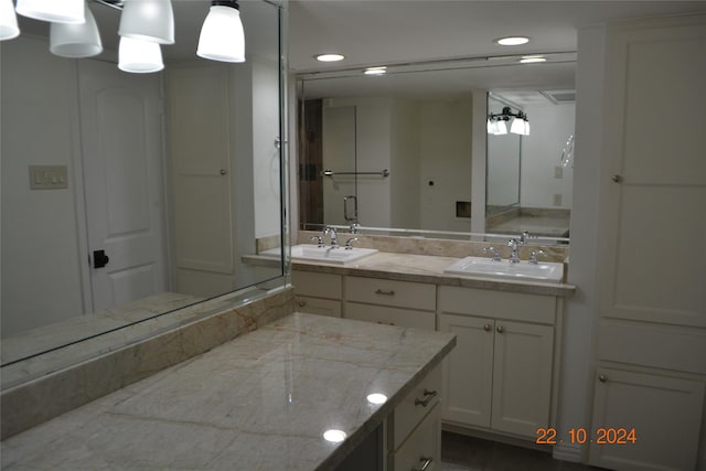 7575 Katy Fwy Unit 9, Houston, TX 77024 - bathroom with double vanity and recessed lighting