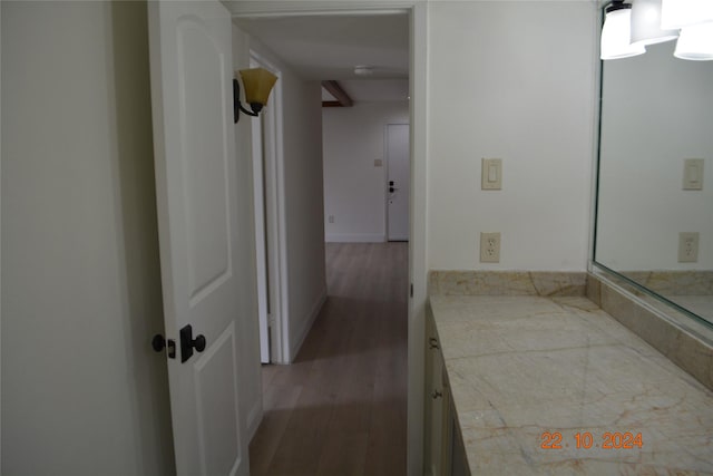 7575 Katy Fwy Unit 9, Houston, TX 77024 - bathroom featuring wood finished floors and vanity