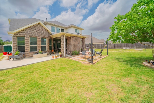 2515 Lilac Point Ln, Brookshire, TX 77423 - back of house featuring brick siding and a patio