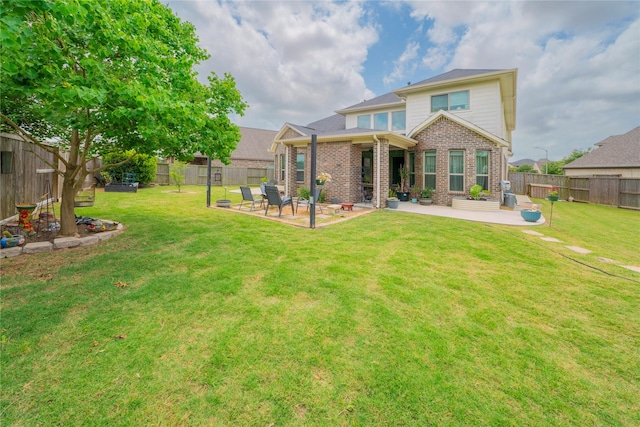 2515 Lilac Point Ln, Brookshire, TX 77423 - back of property featuring brick siding and a patio area