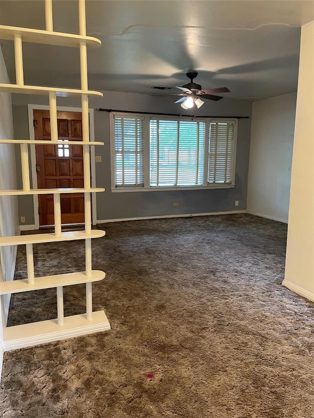 1116 Austin St, Rosenberg, TX 77471 - unfurnished living room with a ceiling fan, carpet floors, and baseboards