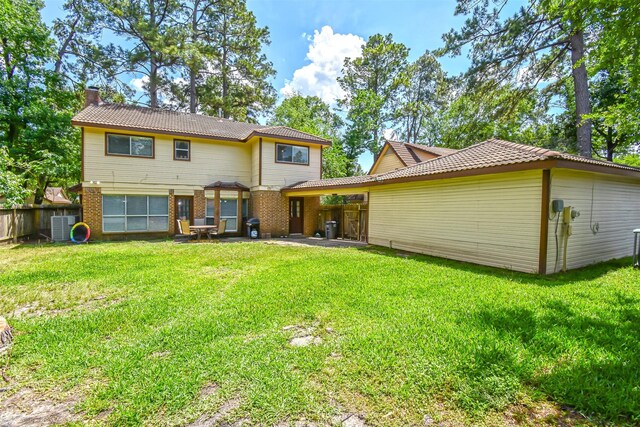3638 Lost Oak Dr, Spring, TX 77388 - rear view of house featuring a chimney, brick siding, central AC unit, and a patio area