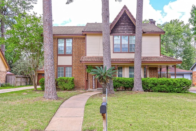 3638 Lost Oak Dr, Spring, TX 77388 - view of front of home featuring a chimney, brick siding, and a tiled roof