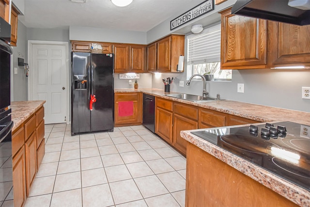 3638 Lost Oak Dr, Spring, TX 77388 - kitchen with black appliances, custom range hood, a sink, and brown cabinets