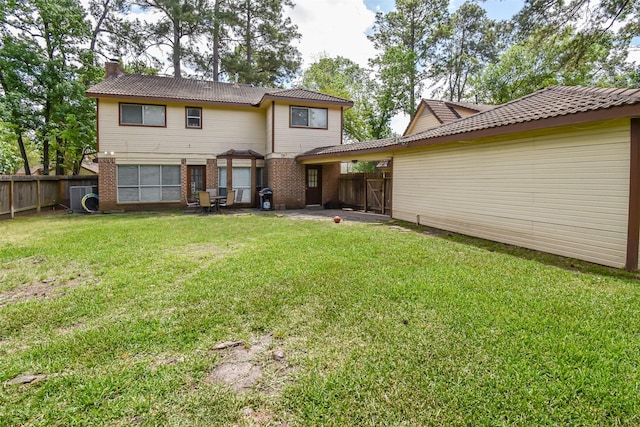 3638 Lost Oak Dr, Spring, TX 77388 - back of house featuring a chimney, brick siding, a patio area, and ac unit