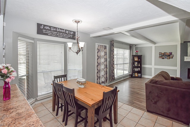 3638 Lost Oak Dr, Spring, TX 77388 - dining area with a chandelier, light tile patterned floors, and a textured ceiling