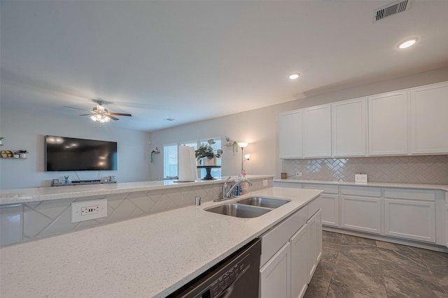 2446 Palisade Crest Dr, Rosharon, TX 77583 - kitchen with a sink, white cabinetry, light stone countertops, backsplash, and recessed lighting