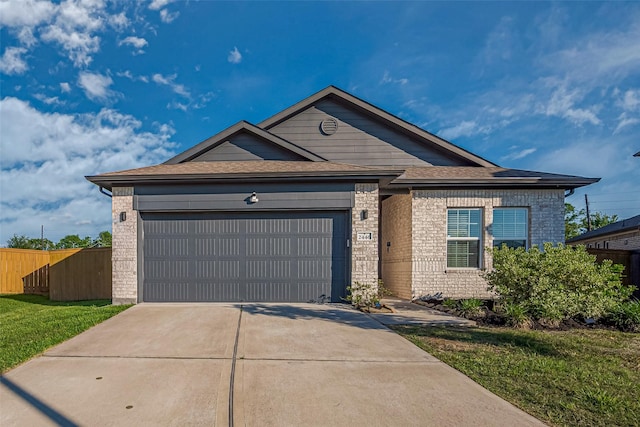 2446 Palisade Crest Dr, Rosharon, TX 77583 - ranch-style home featuring an attached garage, driveway, brick siding, and a shingled roof