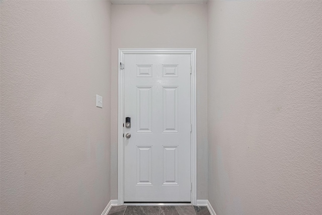 2446 Palisade Crest Dr, Rosharon, TX 77583 - doorway with baseboards and a textured wall