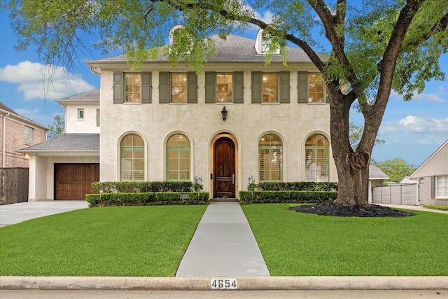 4654 Ingersoll St, Houston, TX 77027 - view of front of home featuring a garage, concrete driveway, stucco siding, and roof with shingles