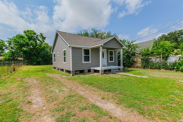 3108 Memel St, Houston, TX 77026 - view of front facade with roof with shingles and a porch