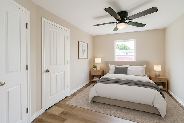 3108 Memel St, Houston, TX 77026 - bedroom with wood finished floors, ceiling fan, and baseboards