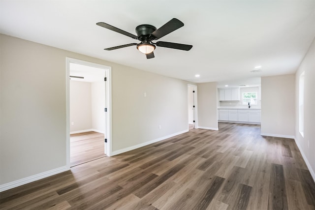 3108 Memel St, Houston, TX 77026 - unfurnished living room featuring wood finished floors, a ceiling fan, baseboards, and recessed lighting