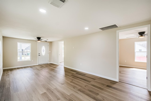 3108 Memel St, Houston, TX 77026 - foyer entrance with ceiling fan, wood finished floors, baseboards, and recessed lighting