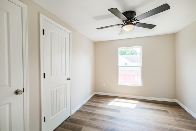 3108 Memel St, Houston, TX 77026 - unfurnished bedroom featuring light wood-style floors, baseboards, and a ceiling fan