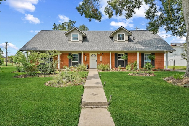 715 Timber Cove Dr, Seabrook, TX 77586 - cape cod house featuring brick siding, a shingled roof, and a front yard
