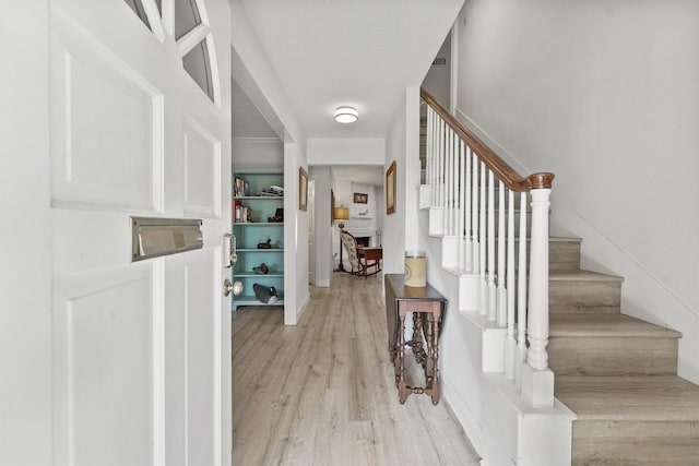 715 Timber Cove Dr, Seabrook, TX 77586 - foyer entrance featuring light wood finished floors and stairway