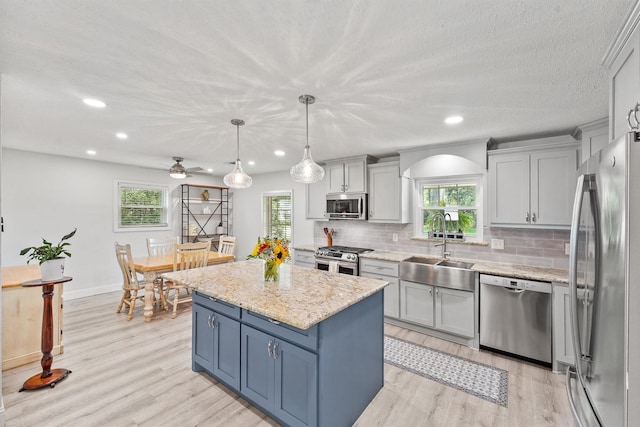 715 Timber Cove Dr, Seabrook, TX 77586 - kitchen featuring appliances with stainless steel finishes, plenty of natural light, light wood finished floors, and recessed lighting