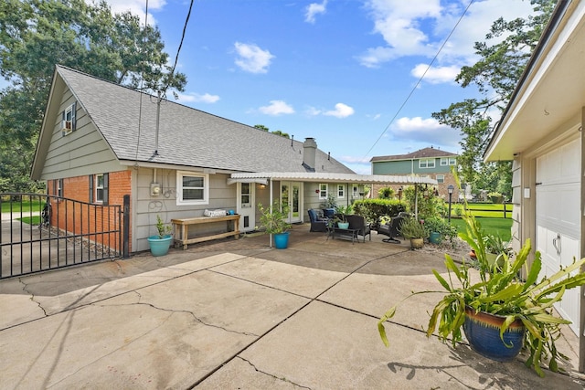 715 Timber Cove Dr, Seabrook, TX 77586 - back of house with roof with shingles, a patio, brick siding, a chimney, and outdoor lounge area