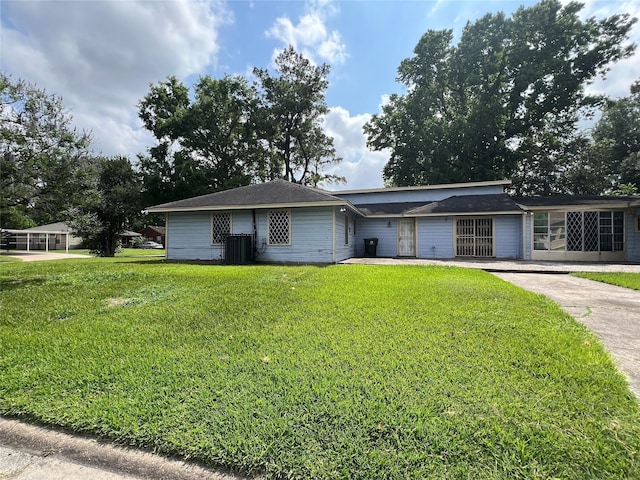 7261 Yoe St, Houston, TX 77016 - view of front of home featuring a front lawn, central air condition unit, and concrete driveway