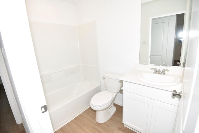 19591 Manduca Dr, New Caney, TX 77357 - bathroom featuring wood finished floors, toilet, vanity, and tub / shower combination