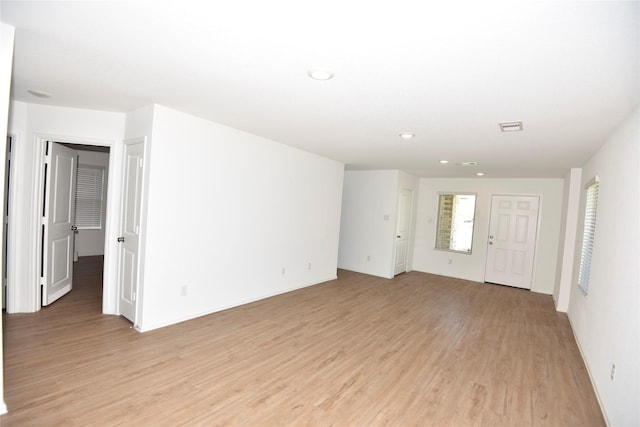 19591 Manduca Dr, New Caney, TX 77357 - unfurnished room with light wood-type flooring and recessed lighting