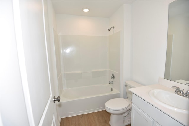 19591 Manduca Dr, New Caney, TX 77357 - full bathroom featuring wood finished floors, toilet, shower / bathtub combination, and vanity