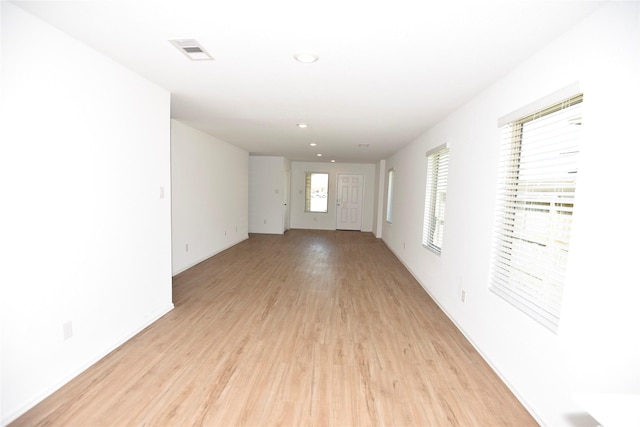 19591 Manduca Dr, New Caney, TX 77357 - unfurnished room featuring light wood-style floors, recessed lighting, and baseboards