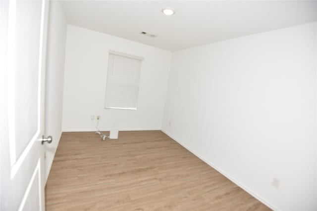 19591 Manduca Dr, New Caney, TX 77357 - spare room featuring light wood-style flooring, baseboards, and recessed lighting